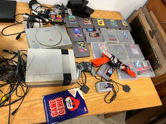 AN NES WITH GAMES, CONTROLLERS, AND ACCESSORIES AND A PLAYSTATION WITH CONTROLLERS AND ACCESSORIES