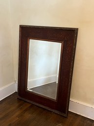 A Beveled Mirror With Painted Wood Frame