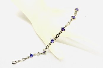 Ladies Silver Tennis Bracelet W/ Purple Stones