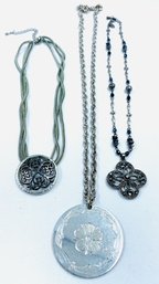 Grouping Of Medallion Style Pendant Necklaces