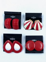 Quartet Of Red Earrings On Cards