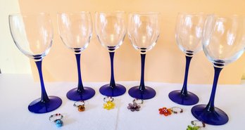 Cobalt Blue Wine Glasses Paired With Flower And Lady Bug Wine Charms