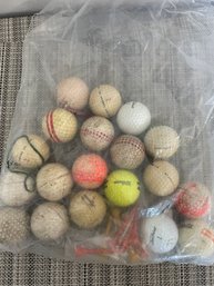 Assortment Of Golf Balls And Tees