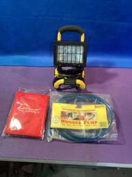 Halogen Work Light, Wonder Pump Self Priming, And Resorts World Ice Scraping Glove