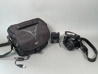 A Leica LUMIX Panasonic F 2.8 Camera With Bag.