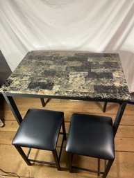 Faux Marble Tile Table With Two Black Stools