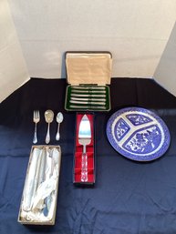 A Box Of China And Silverware