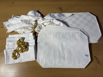 Eight White Placemats And Napkins With Eight Shiny Gold Napkin Knots/rings