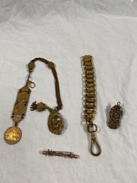 Egyptian Revival Watch Chain And Other Golden Pieces