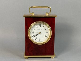 A Vintage Howard Miller Rosewood & Brass Tabletop Carriage Clock