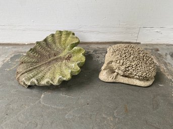 A Cement Hedgehog And Leaf