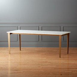 A CB2 Marble Top Table On Metal Legs