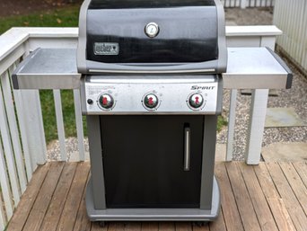 Weber Grill With Cover And A Full Propane Tank. A Remote Thermometer Is Included.