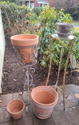 Group Of Four Planters And Two Plant Stands