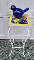 Ceramic Blue Bird Statuette And Blue And Yellow Mosaic Top Outdoor Stand