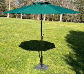 A Patio Umbrella With Cast Iron Base By Sunbrella