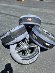 4 Audi Tires With Rims And Covers In Good Condition