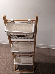 Metal Cloth Lined Storage Baskets On Wood Rack