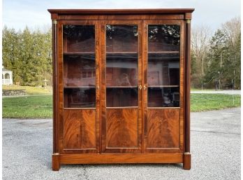 A Gorgeous 19th Century French Empire Bookcase With Crotch Mahogany Paneled Doors