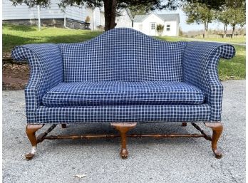 A Vintage Camel Back Loveseat With Down Cushion