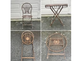 A Vintage Wrought Iron Folding Cafe Table With Folding Chair