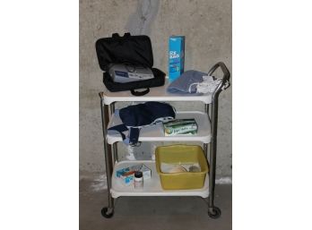 Medical Utility Rolling Cart. Complete With Medtronic Heart Rate Monitor, Arm Sling, Heating Pad, Etc.