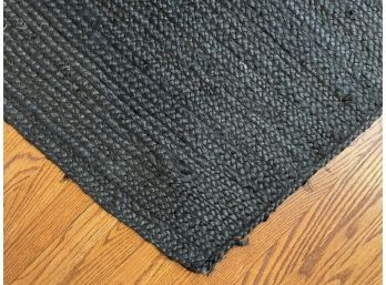 A Woven Natural Fiber Black Rug By Nuloom