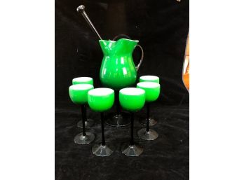 Green And Black Stemmed Glasses And Pitcher