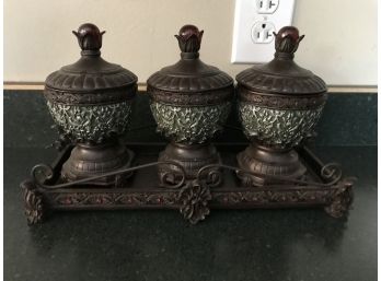Three Small Jars With Lids In Tray