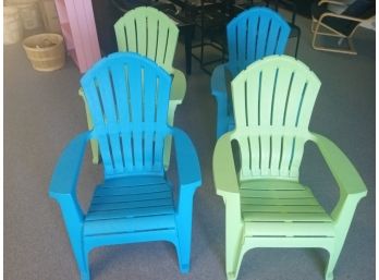 Four Plastic Stackable Adirondack Chairs By Adams