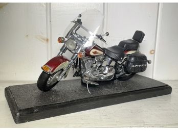 A Model Harley Davidson Motorcycle On Base