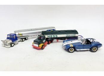 Model Hess Trucks And A Die Cast Car