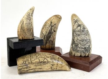 A Set Of Reproduction Carved Whales Teeth