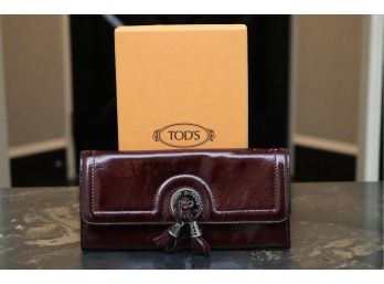Tod's Cordovan Patent Leather Double Tassle Wallet ($325)