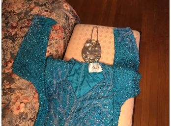 Milena's Beaded Turquoise Ball Gown With Hand Bag