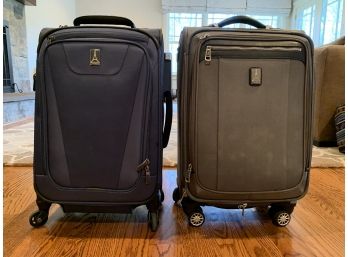 Two Travelpro Carry-on Rolling Suitcases
