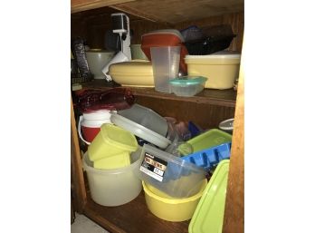 Cabinet Full Of Plastic Storage Dishes