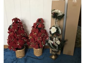 Two Poinsettia Trees And Two Holiday Topiaries