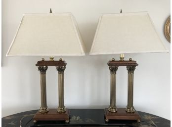 Pair Of Pillar Lamps On A Wood Plinth