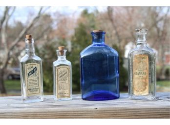 Collection Of Four Vintage Bottle From Raleigh's, Paregoric, Pure Sweet Oil & W C Mind Art Studio Blue Glass