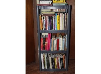 4-tier Plastic Shelving Unit Full Of Miscellaneous Books