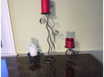 Three Metal Candleholders With Attached Aandles