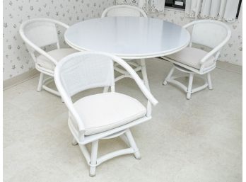 Sleek White Dining Table With Four Wicker Seats