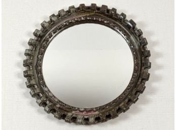 Small Round Mirror With A Metal Frame