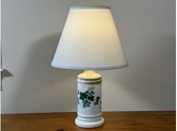 A Ceramic Lamp With An Ivy Motif