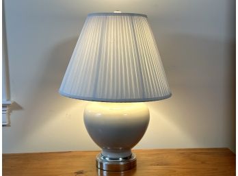 A Vintage Ceramic Urn Lamp With A Pleated Shade