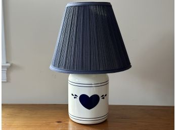 A Pottery Lamp With A Heart Motif