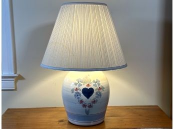 A Vintage Pottery Lamp With A Floral Heart Motif