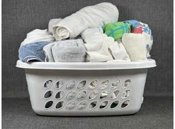 A Laundry Basket Full Of Assorted Towels