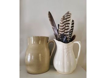 Two Stoneware Pitchers, The Tan One Is An Antique And The Other Is Vintage & Has A Lot Of Great Feathers